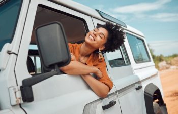 Relax black woman on road trip, happy with view of desert and transport in jeep or car on holiday in Cairo. Travel adventure drive, smile in summer vacation and explore freedom of nature in the sun